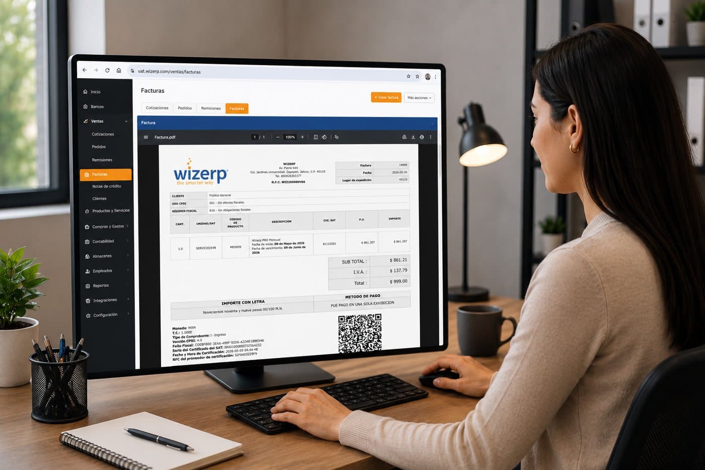 Empresaria revisando un CFDI 4.0 timbrado en Wizerp con folio fiscal, datos del receptor, totales y código QR del SAT